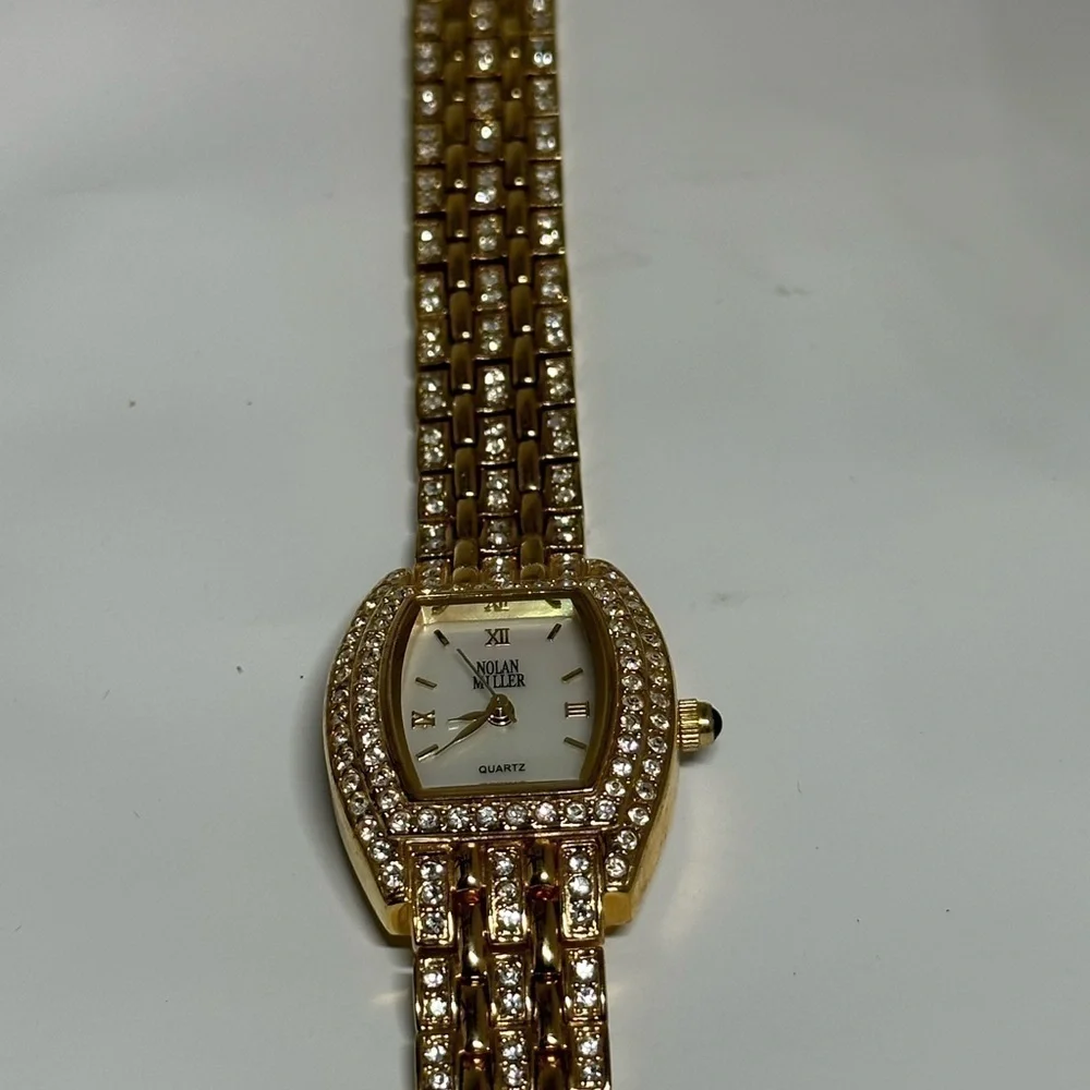 Peire Bernie oval shape Goldtone and Rhinestone women’s watch.